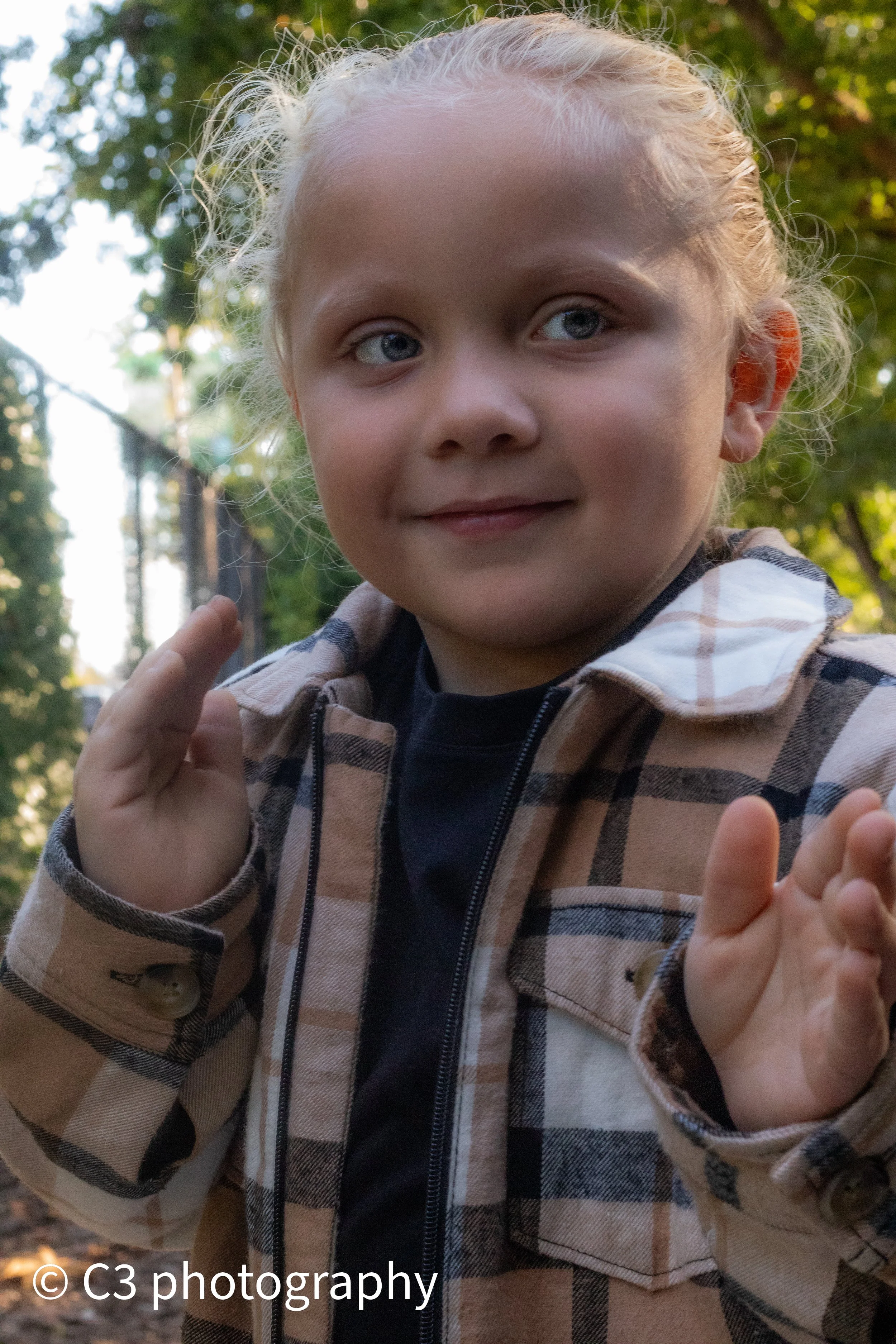 Portrait photography of Little boy in karate pose at the St Louis Missouri zoo