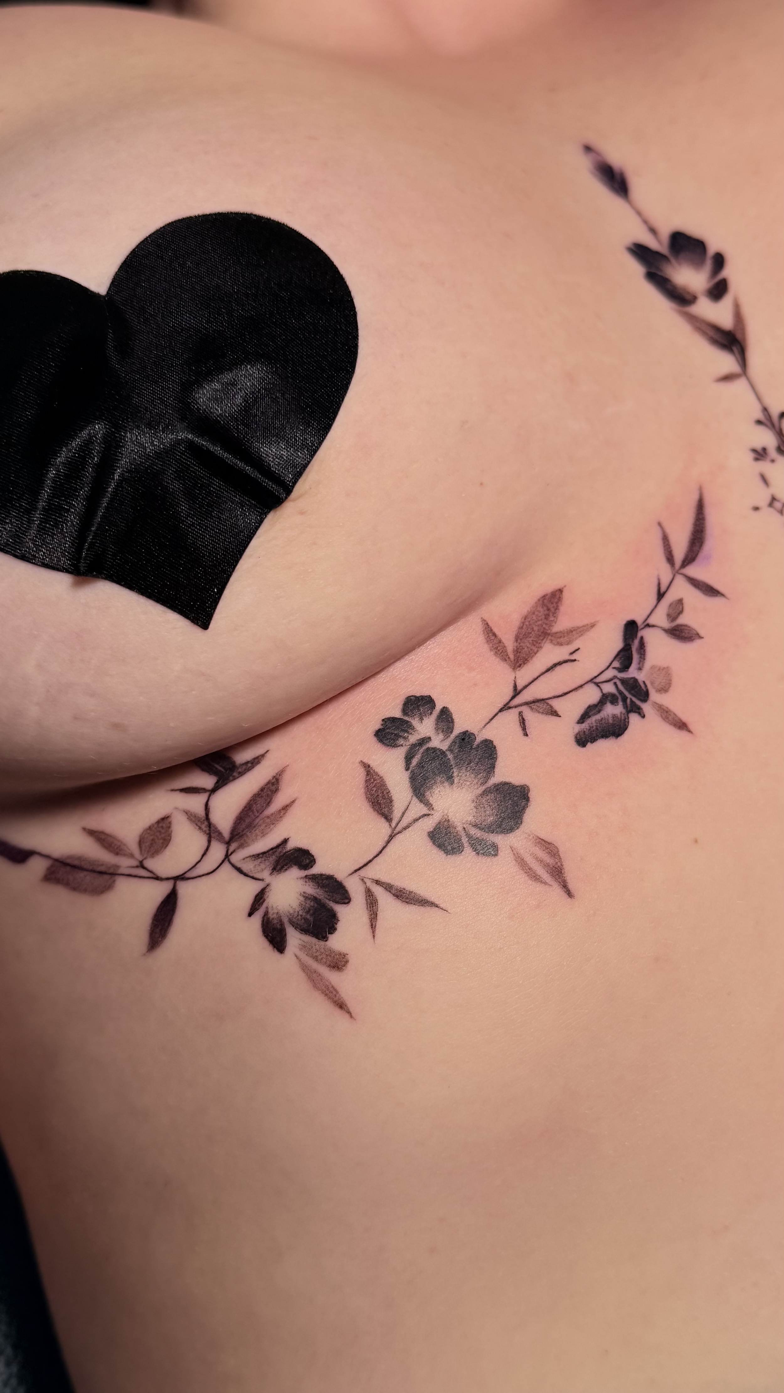 floral under boob tattoo