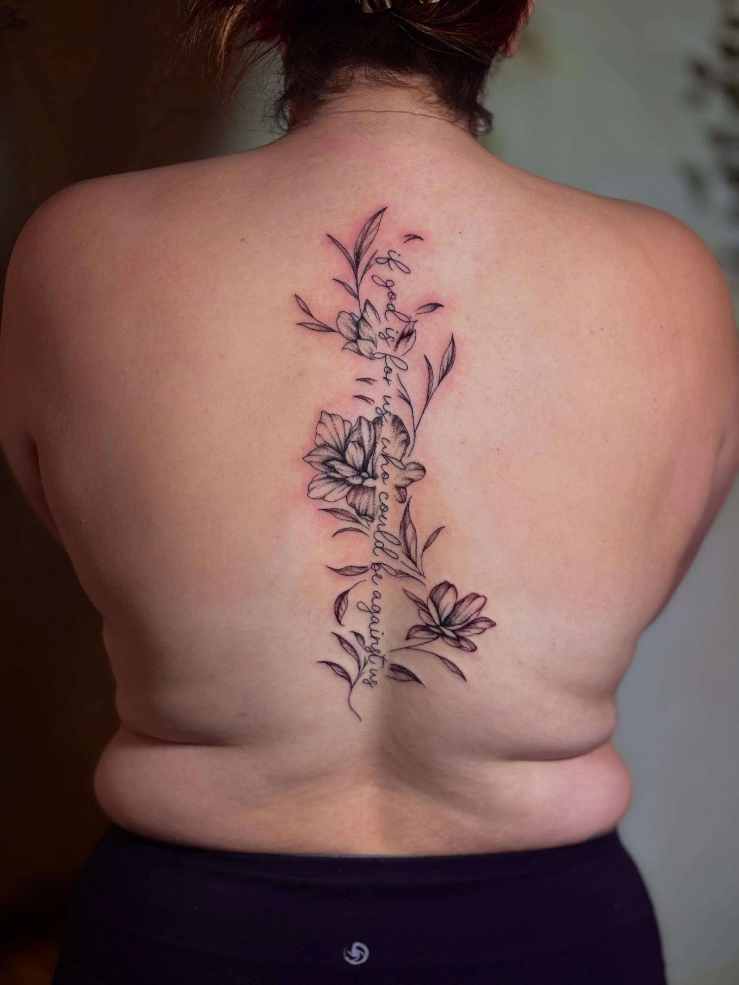 spine floral tattoo