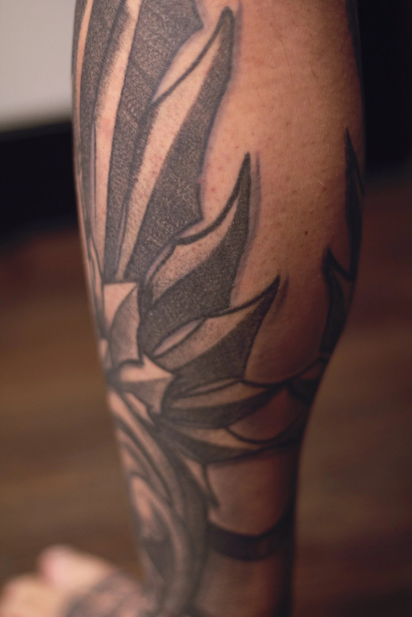 19.4 cheko-ornamental-hermes-leg-tattoo-back.jpg