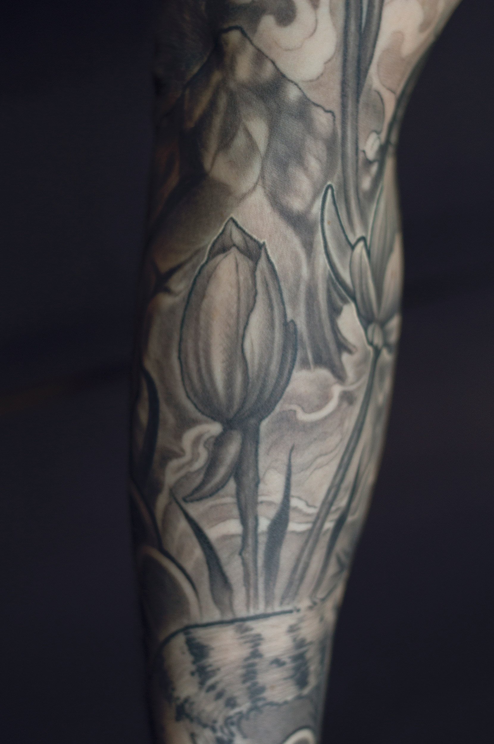 22.7 cheko-pond-flowers-sleeve-tattoo.jpg