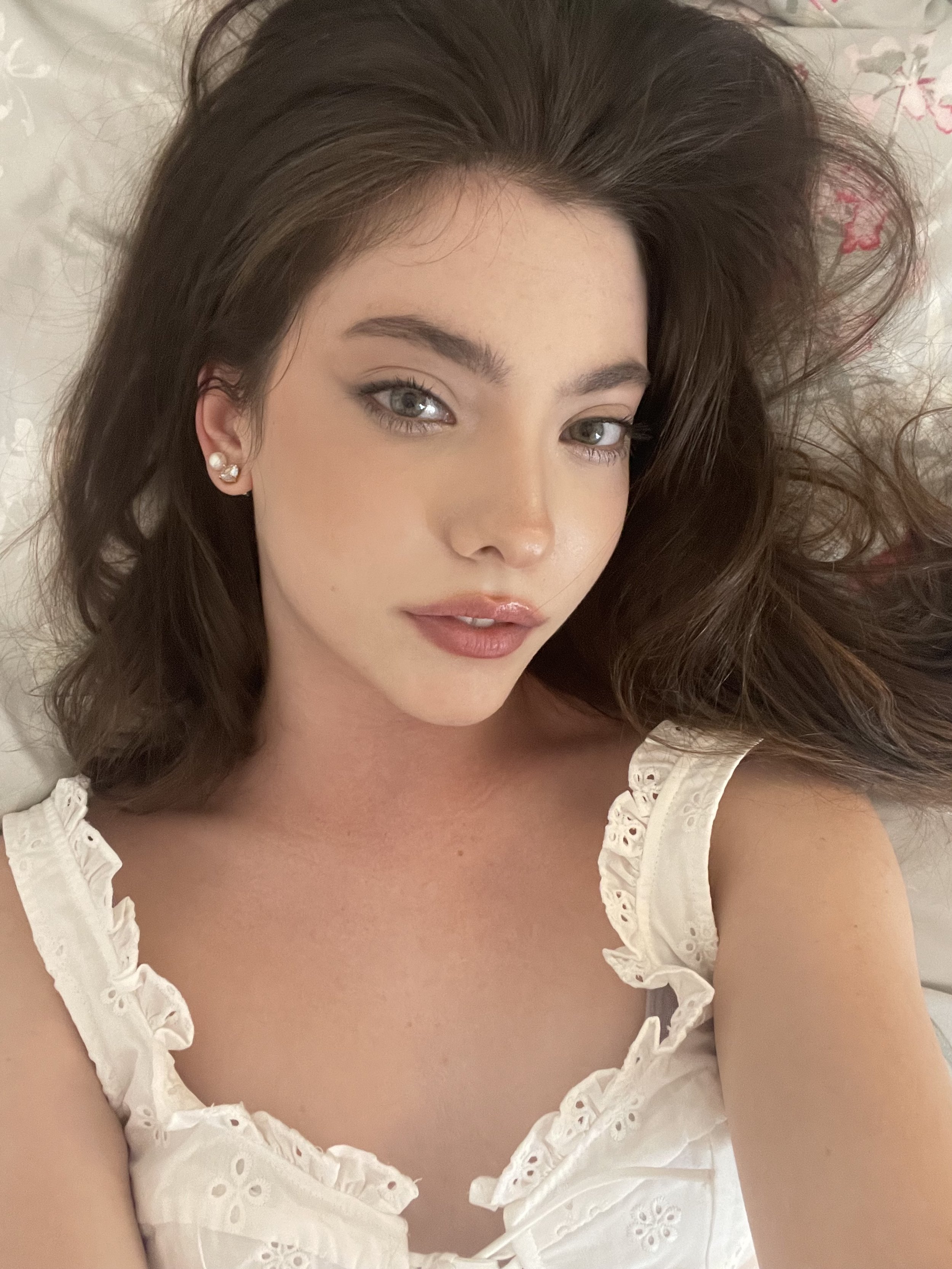 Madelyn lying down and looking at the camera