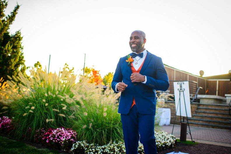 Groom portrait during Liberty State Park wedding golden hour