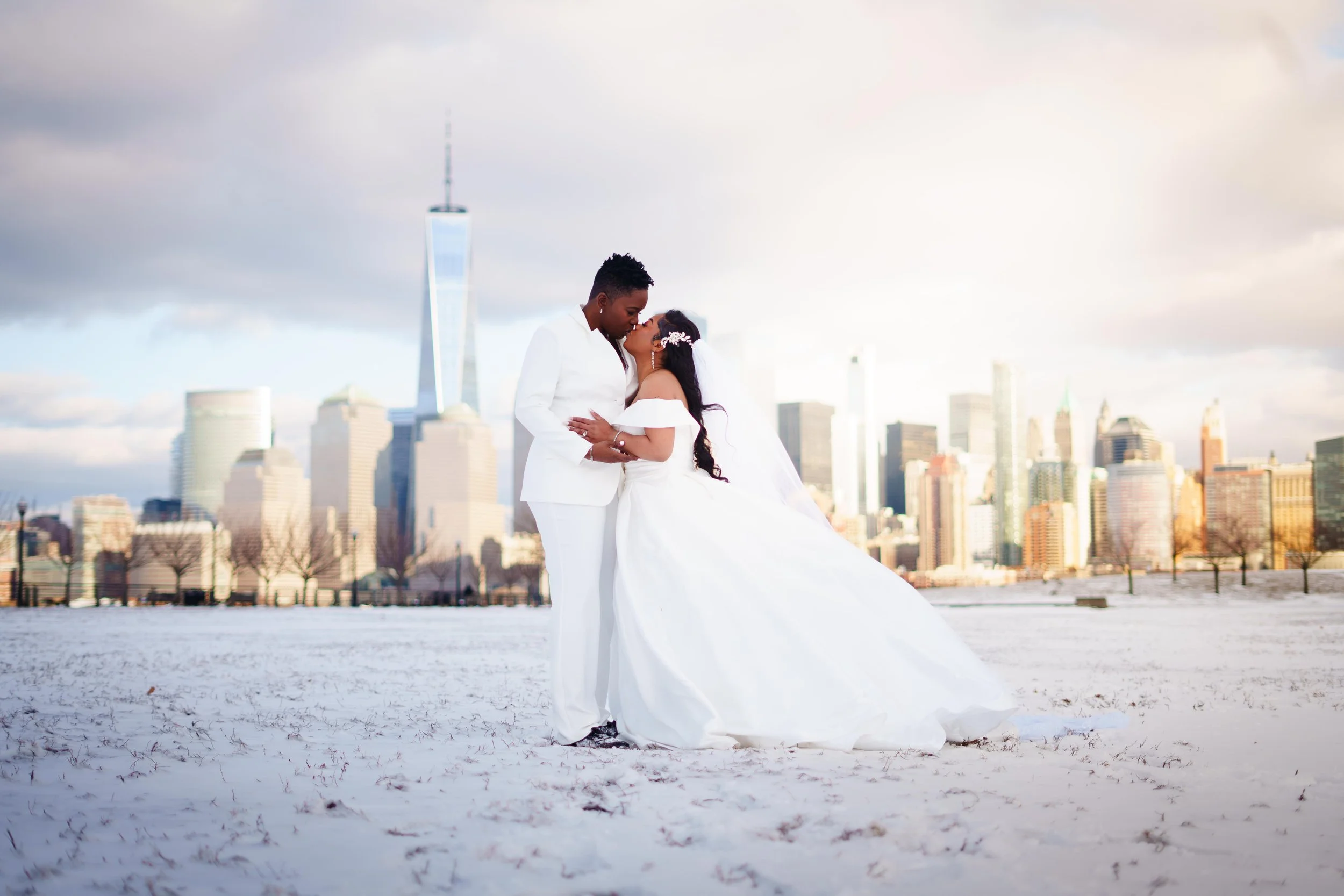 An Lgbtq couple having a liberty state park wedding