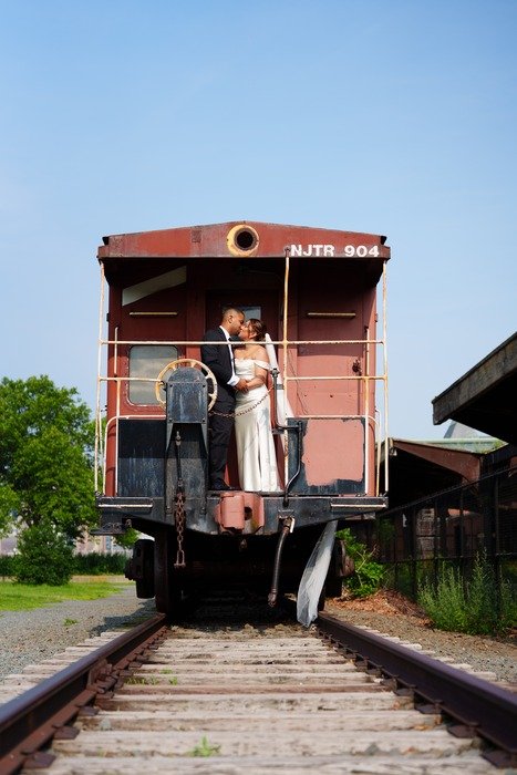 Unique Liberty State Park wedding photo on train tracks with couple