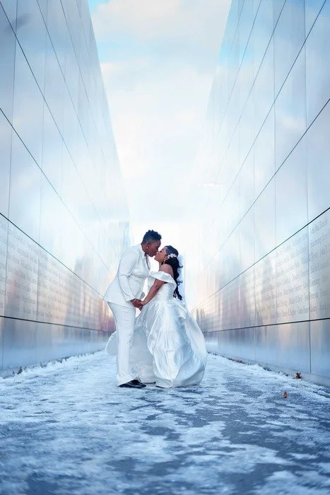 Winter Liberty State Park wedding couple portrait in snow at 9/11 memorial