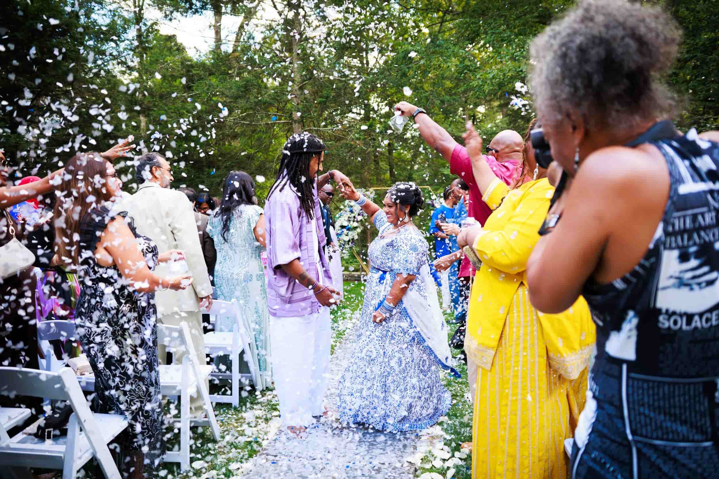 A-diverse-group-of-people-celebrating-a-wedding-outdoors-throwing-confetti-at-arrow-park.jpg