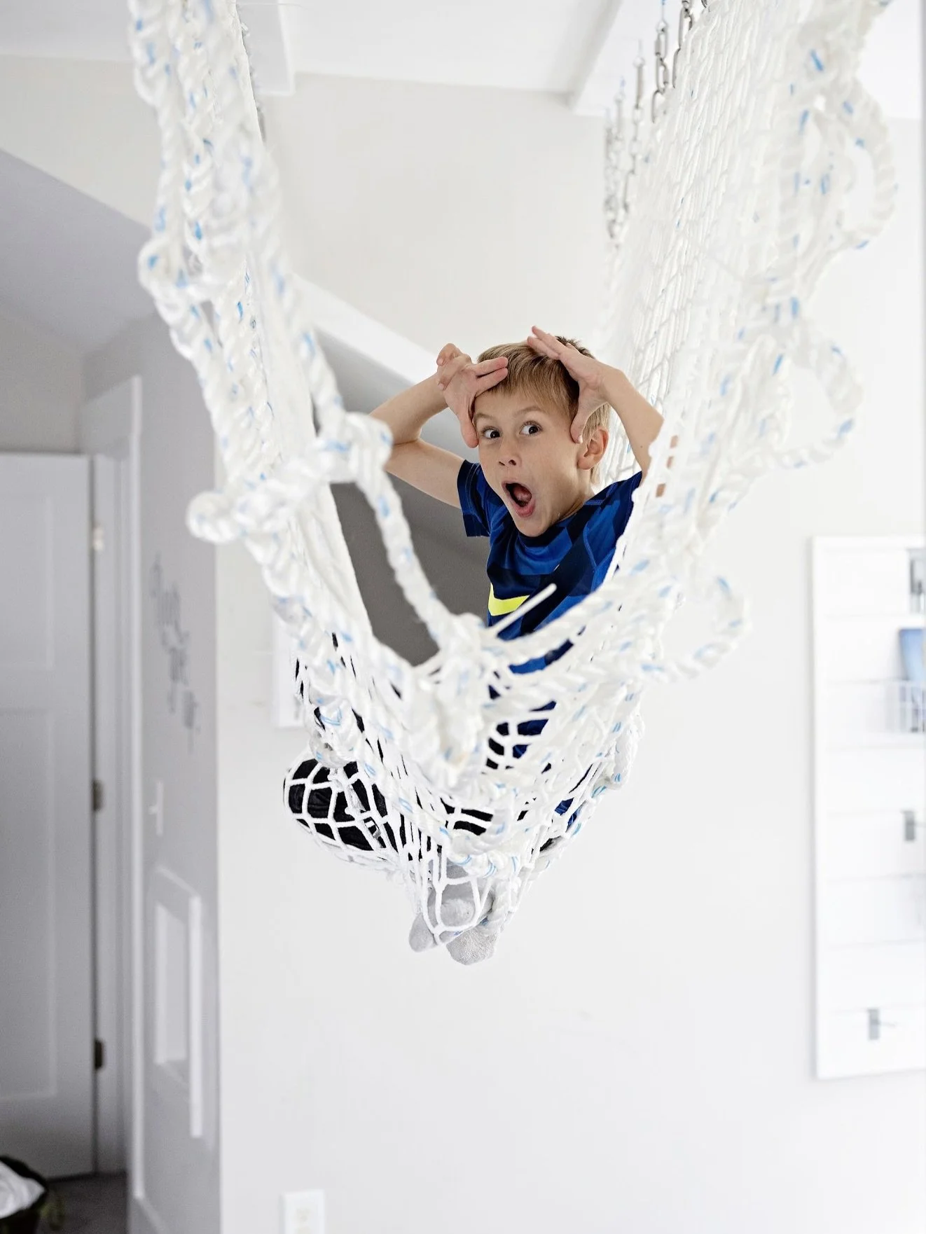 Cargo net tunnels for the win! We love these space saving playroom additions! The kids climb on them, through them, and outside them. They can be a spot for kids to perch in with a book, a hideout or an HQ for their adventures. However kids play with
