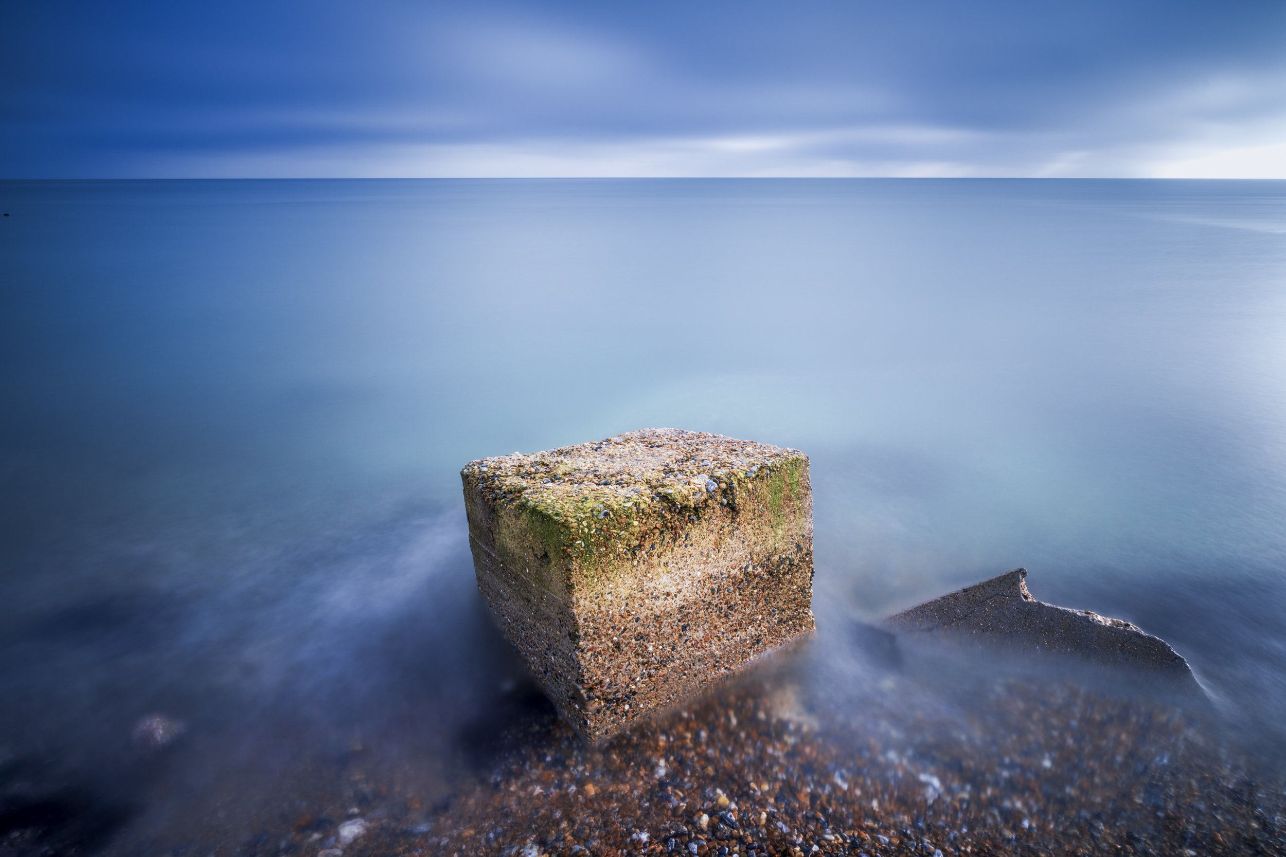 Cubed - Ruined defences on Climping Beach are testament to the power of the sea. These cubes are actually the remains of old tank traps, placed to defend against beach landings during World War II.