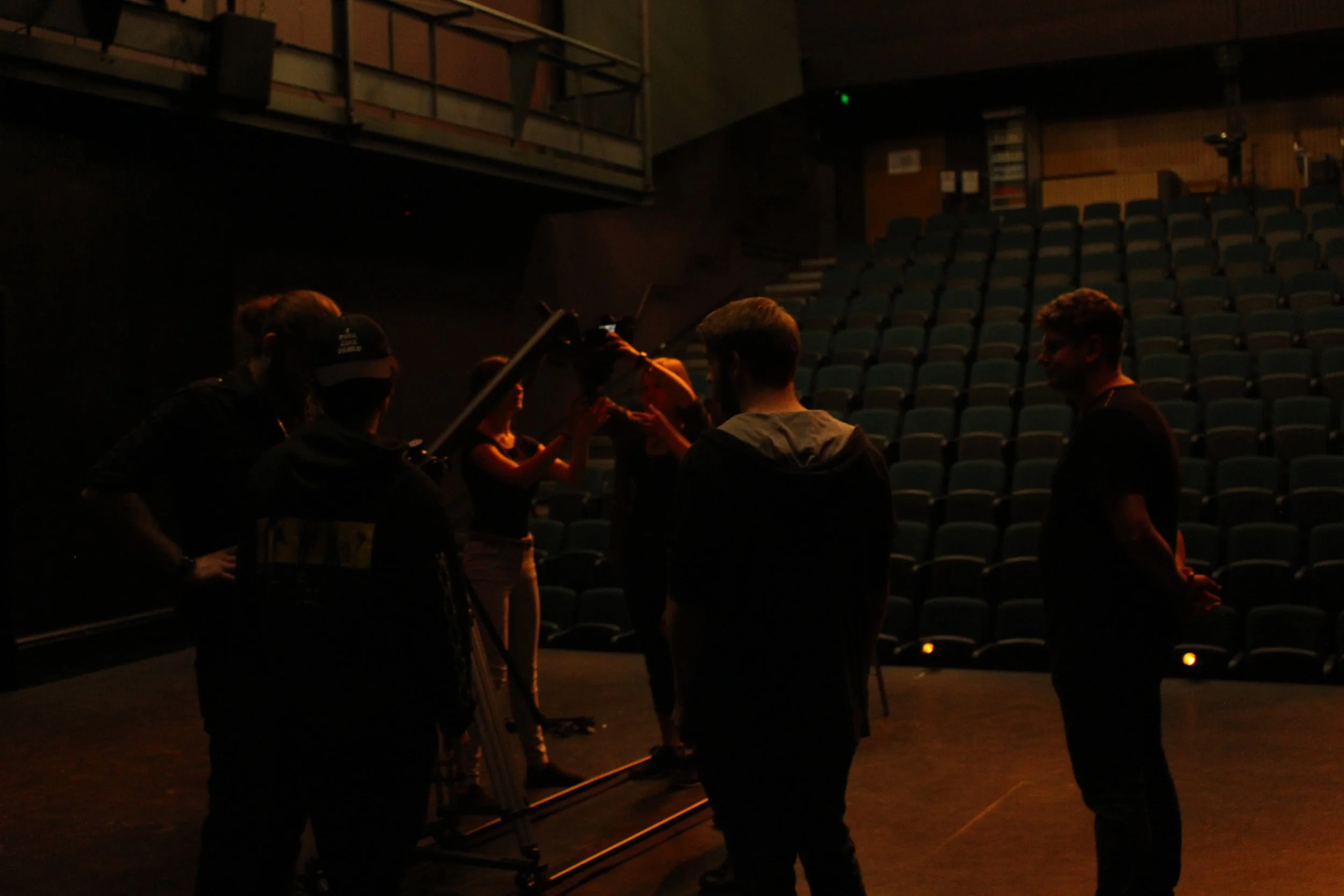  The crew sets up the JIB before a crowd of extras enter the room     