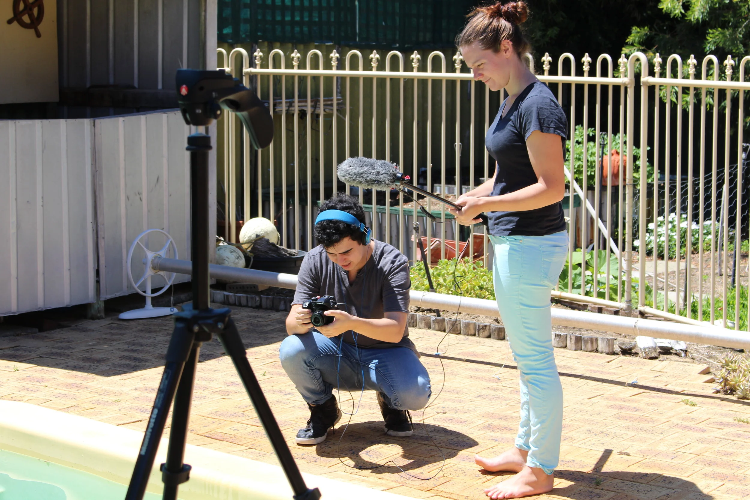  Behind the Scenes: Jake De Agrela and Brea-Anne Gray work on some pool shots 