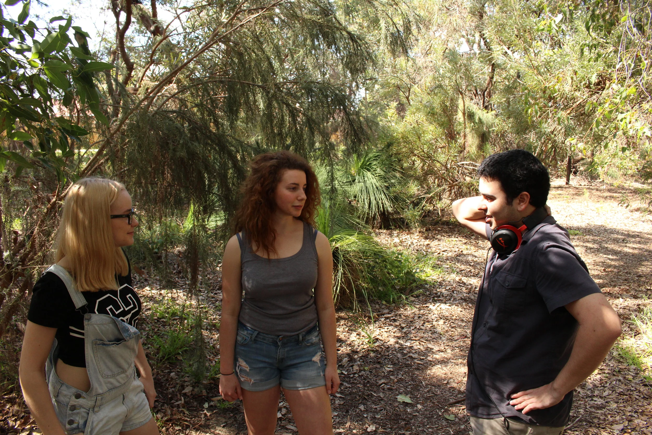  Director Jake De Agrela talks the scene through with Bethany Tandy and Allie Helsemans. 
