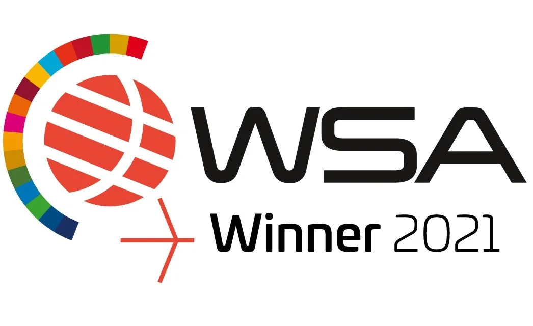 Logo of WSA with a colorful circular design and red globe logo, indicating a 2021 award for winning.