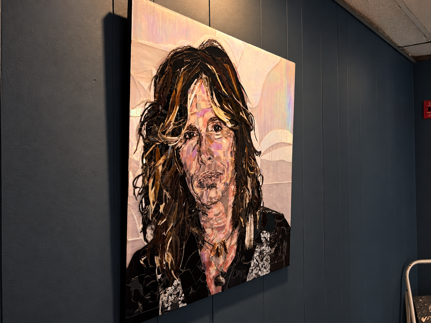 andmade Steven Tyler Aerosmith fused glass portrait featuring detailed multicolor glass, dark hair, and an iridescent background