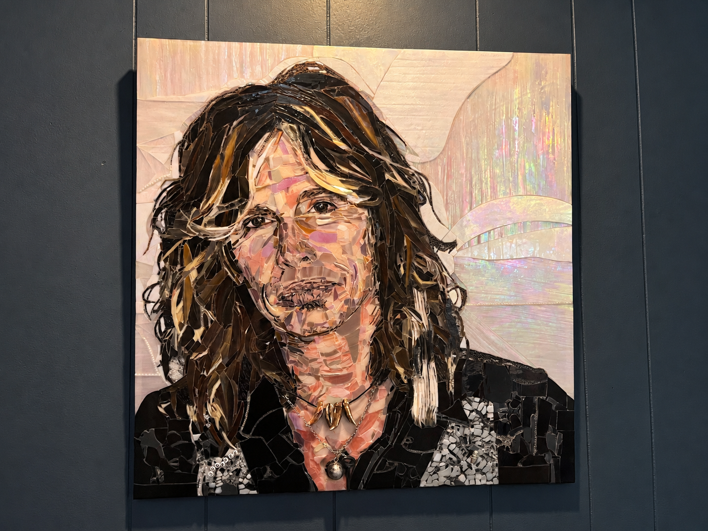 Handmade Steven Tyler fused glass portrait featuring detailed multicolor glass, dark hair, and an iridescent background