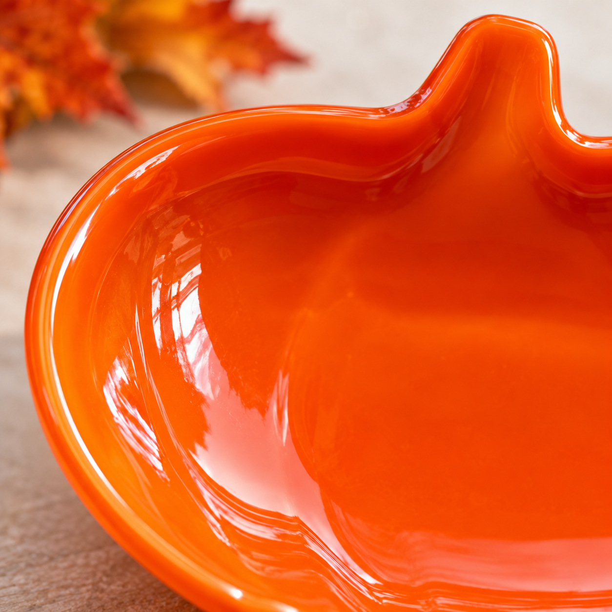 Close-up of handmade fused glass pumpkin dish showing glass details