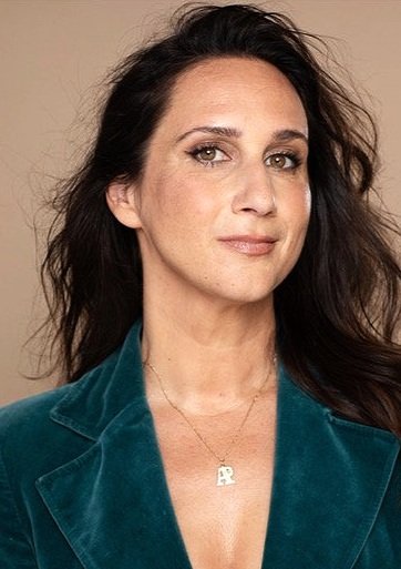 Ariane Price wearing her favorite crushed velvet green blazer that was once worn by her grandmother.