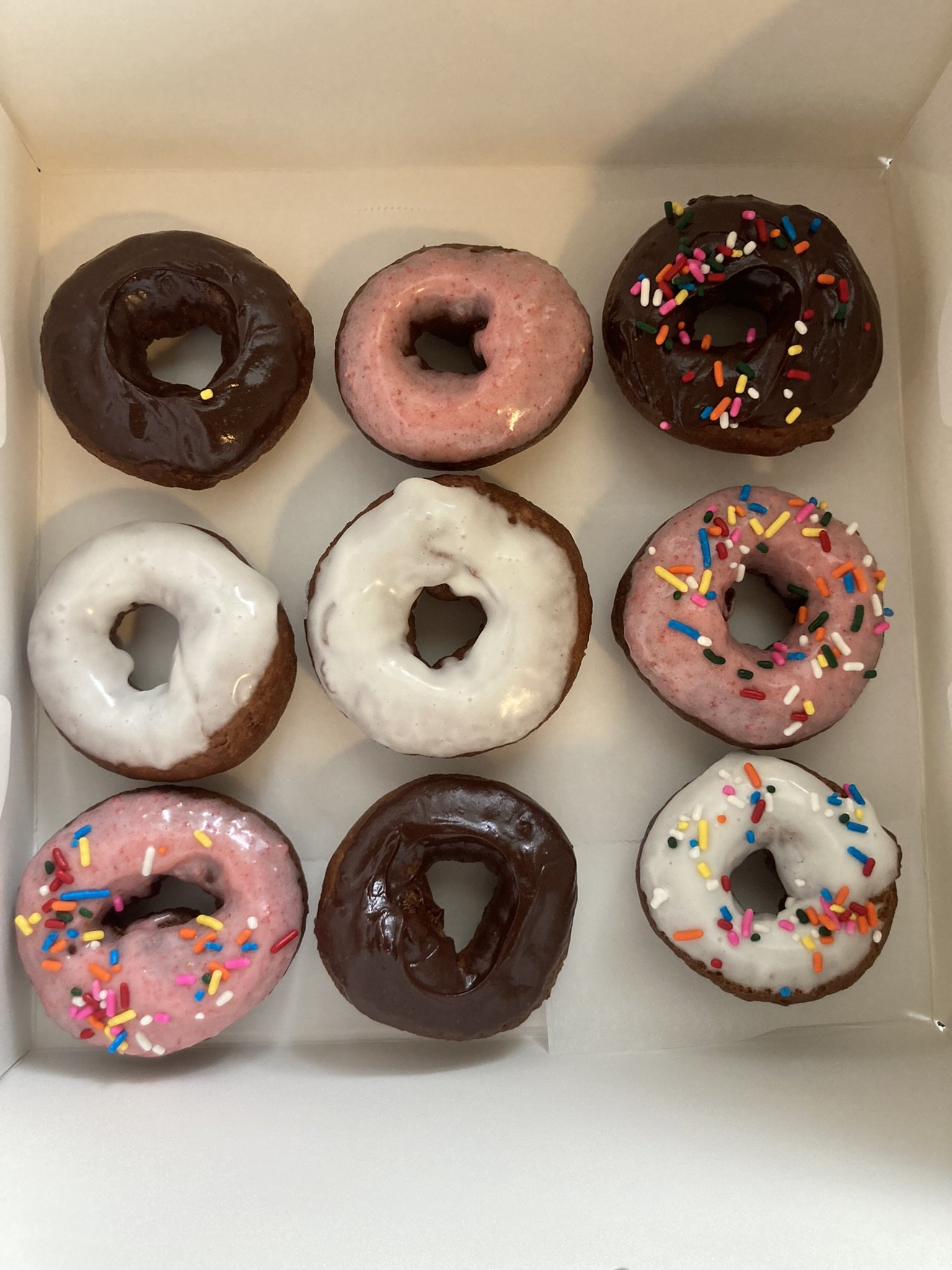 Sour cream donuts with chocolate, vanilla & strawberry frosting