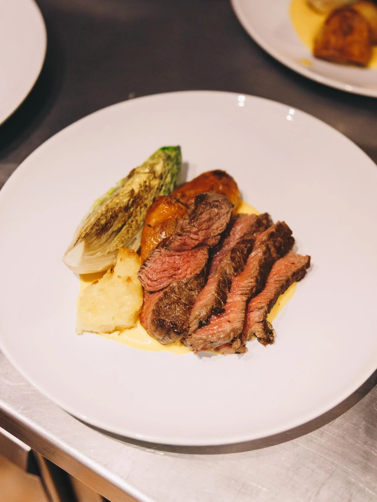 Dinner is served.

Opening night started strong with a classic French steak served medium rare, with rosemary roast potatoes, roasted butternut squash puree, chargrilled lettuce - paired with a chimichurri sauce that was simply to die for.

After a l
