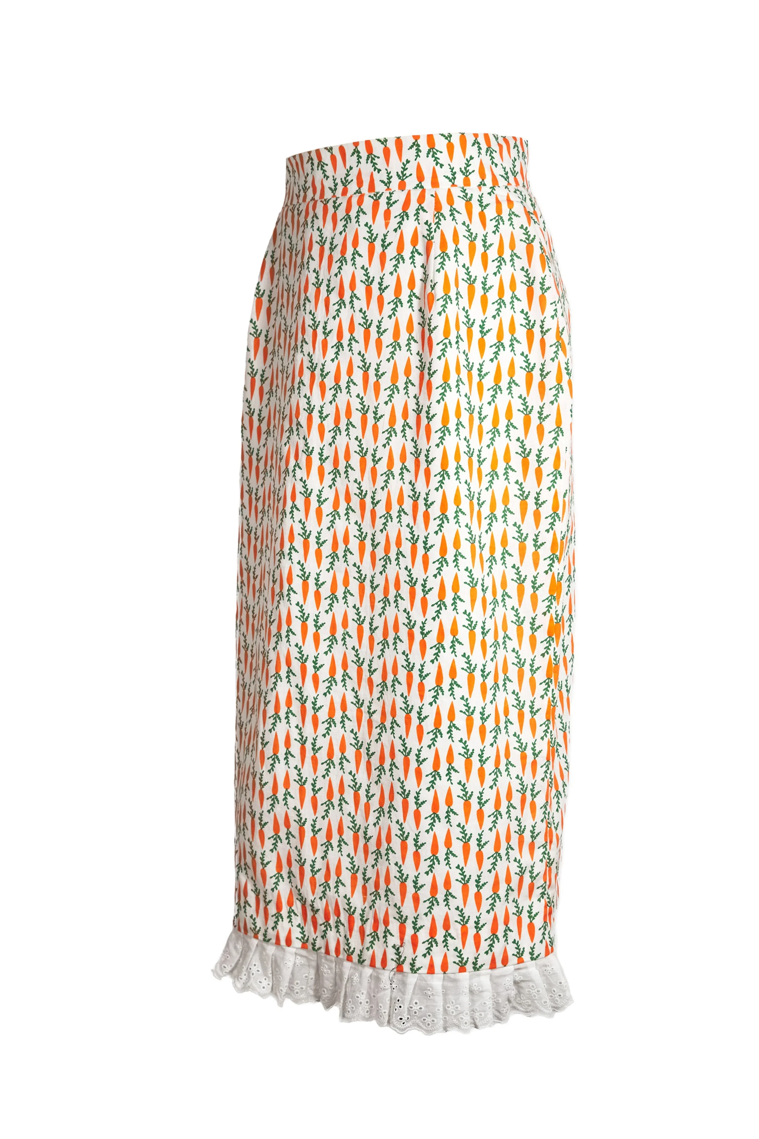 Cream cotton carrot print midi skirt side view showing silhouette and broderie anglaise trim — Carrot Cake by B.Brand