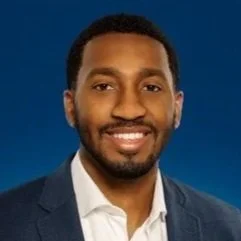 Headshot of man in suit
