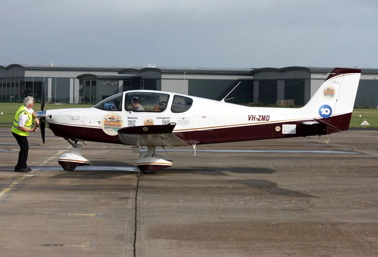 Andrew crank starting the plane.jpg
