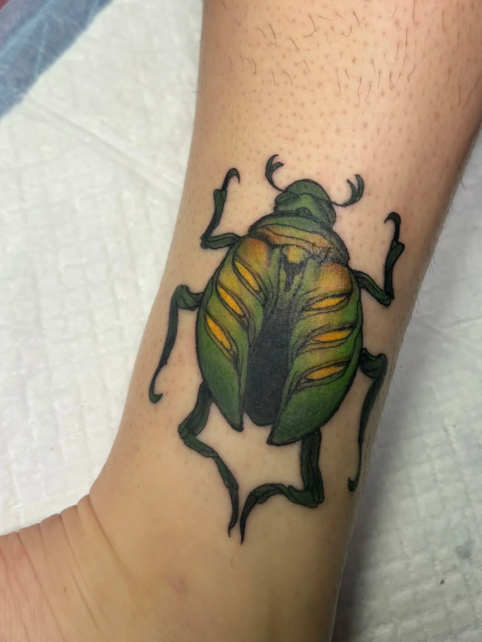colorful small beetle tattoo iridescent 