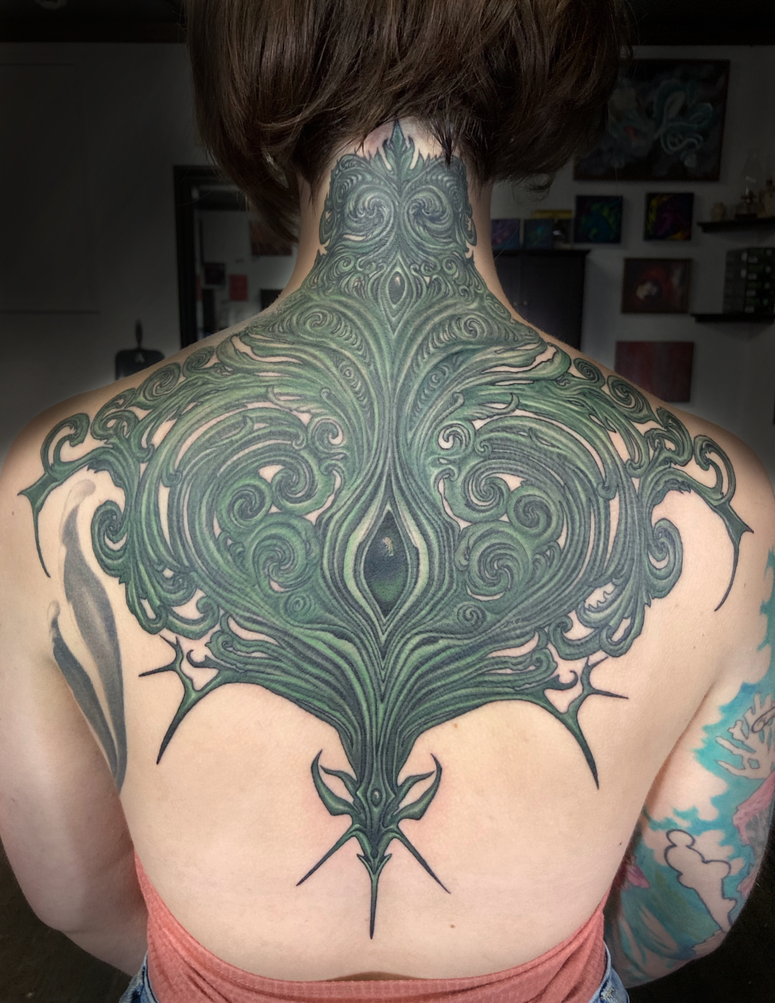 abstract beautiful ornate back tattoo biomech
