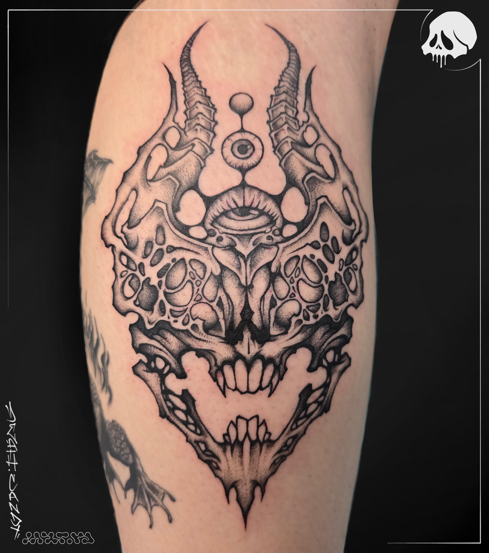 A tattoo of a blackwork skull connor smith deathcandy_art tattoo artist seattle washington.