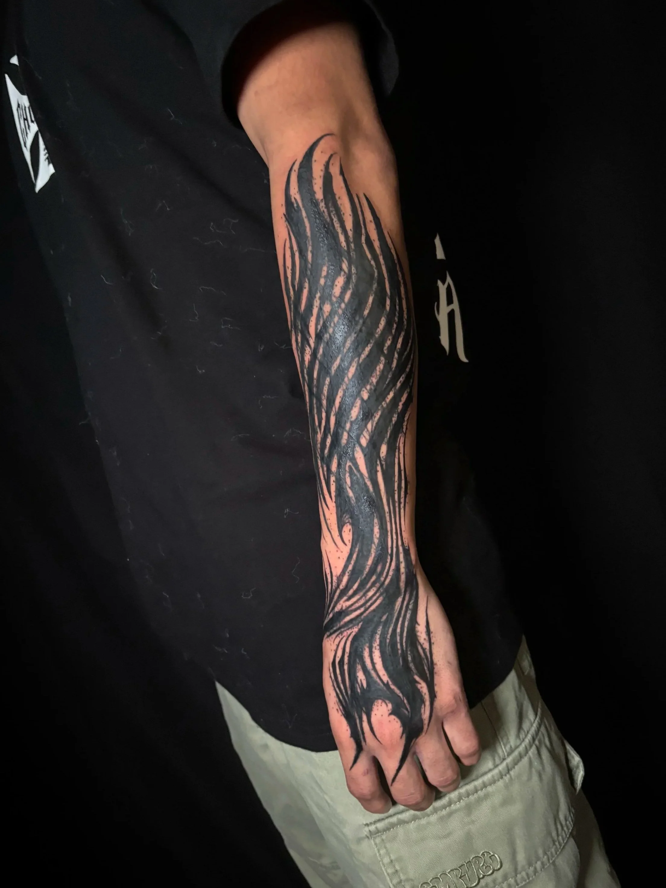 neotribal blackwork coverup tribal abstract tatoo