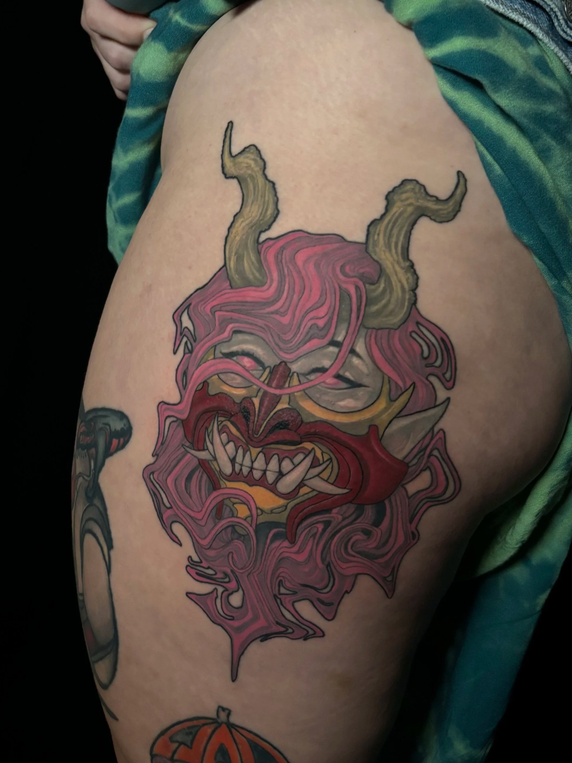 Abstract flowing hanya mask on woman with horns