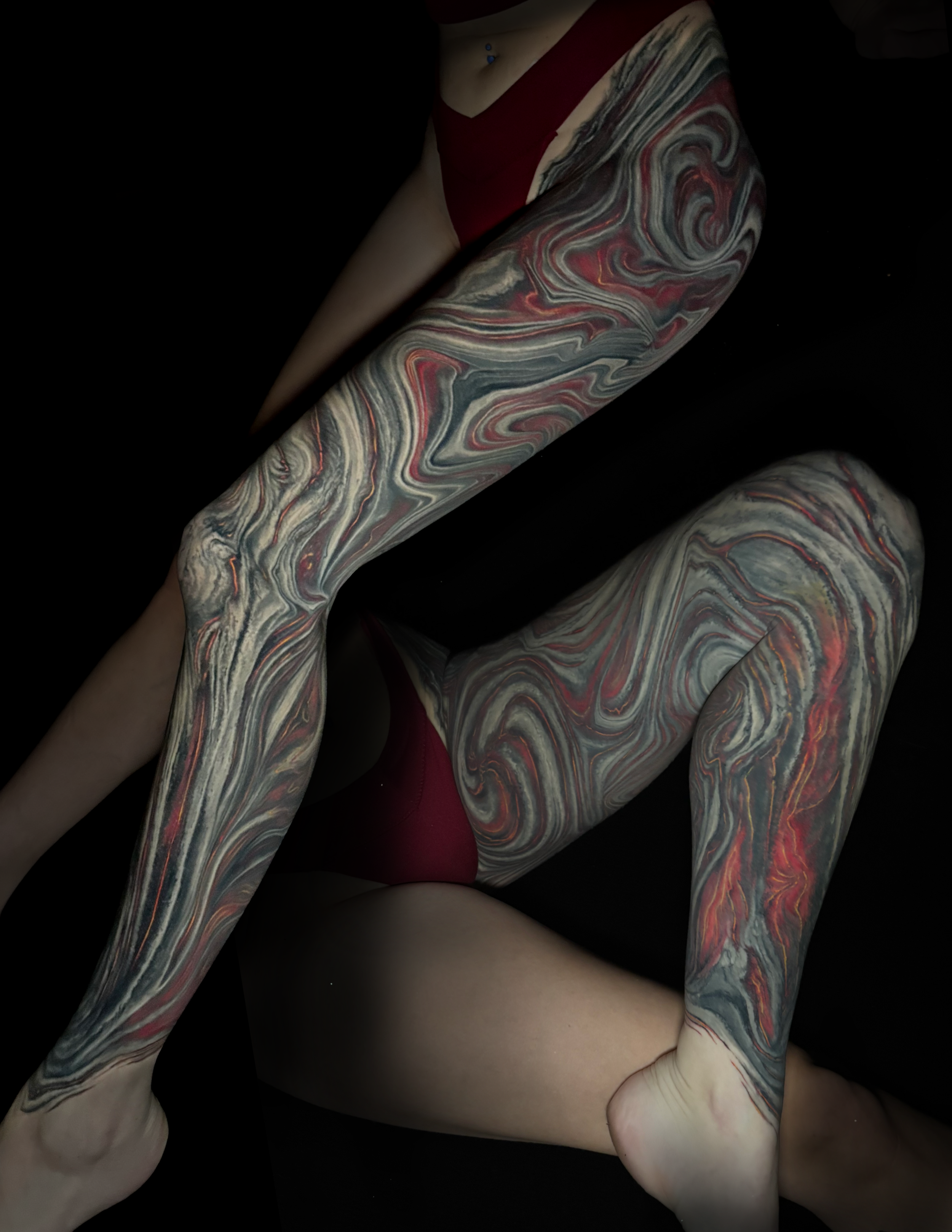 Biomech leg tattoo abstract