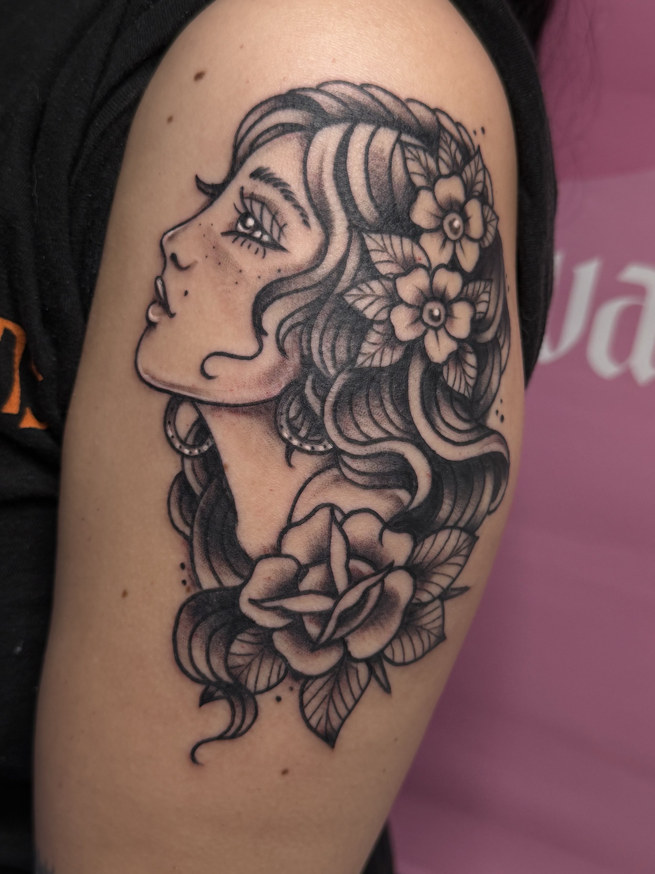 Tattoo of a cow being abducted by a UFO, with clouds and colorful background on a person's arm. Chelsea Graham illustrative, american traditional, and kawaii tattoo artist seattle washington.