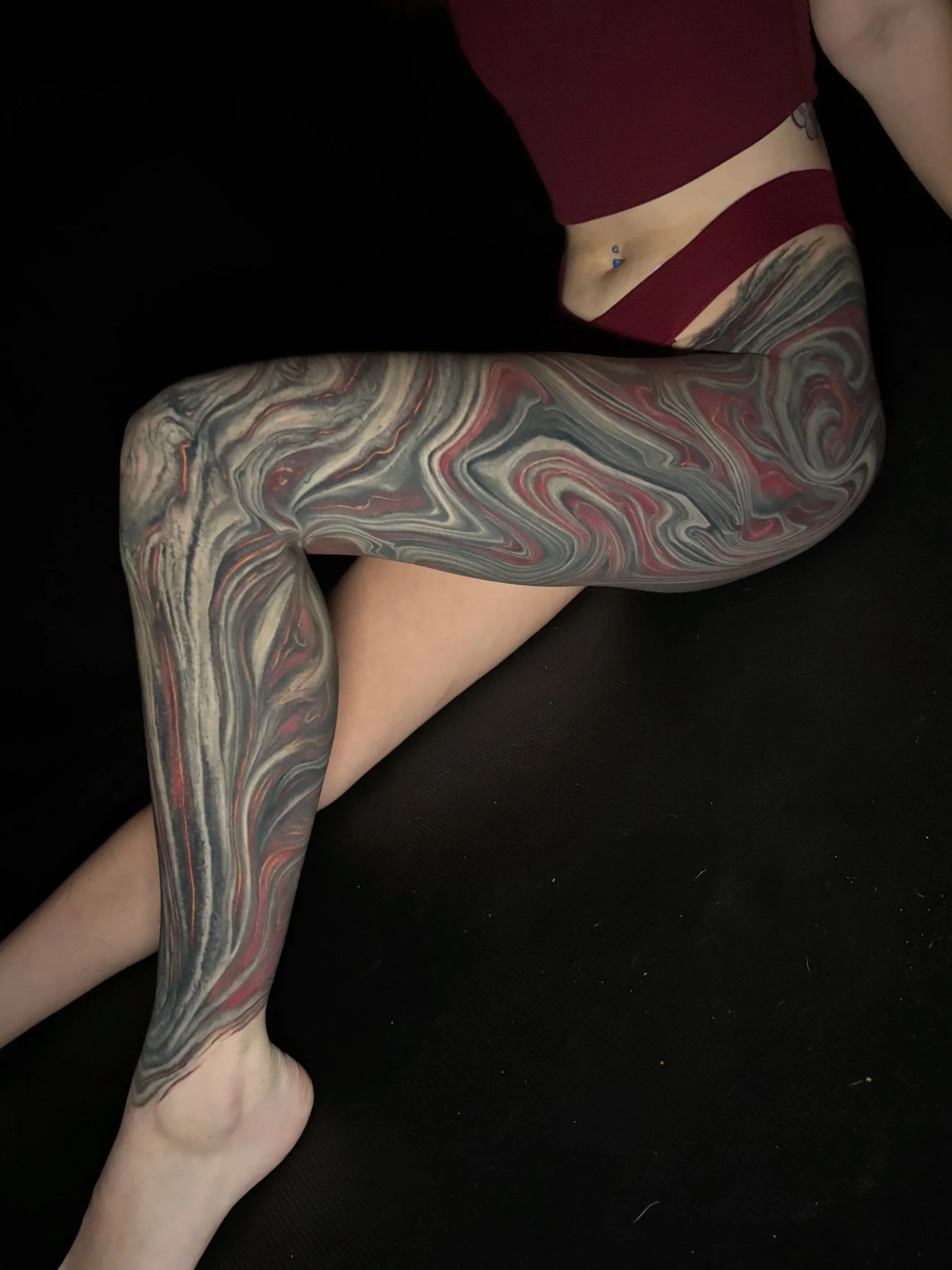 large abstract tattoo flowing marble full leg flowing biomechanical 