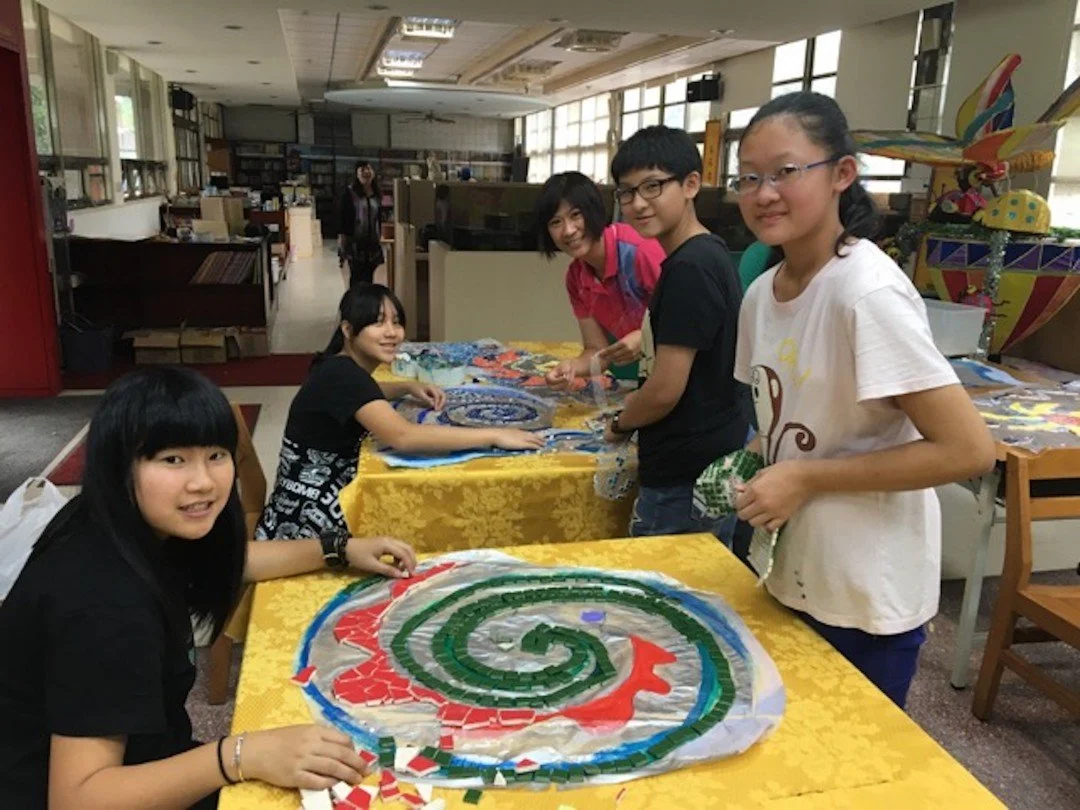 6th graders making mosaics