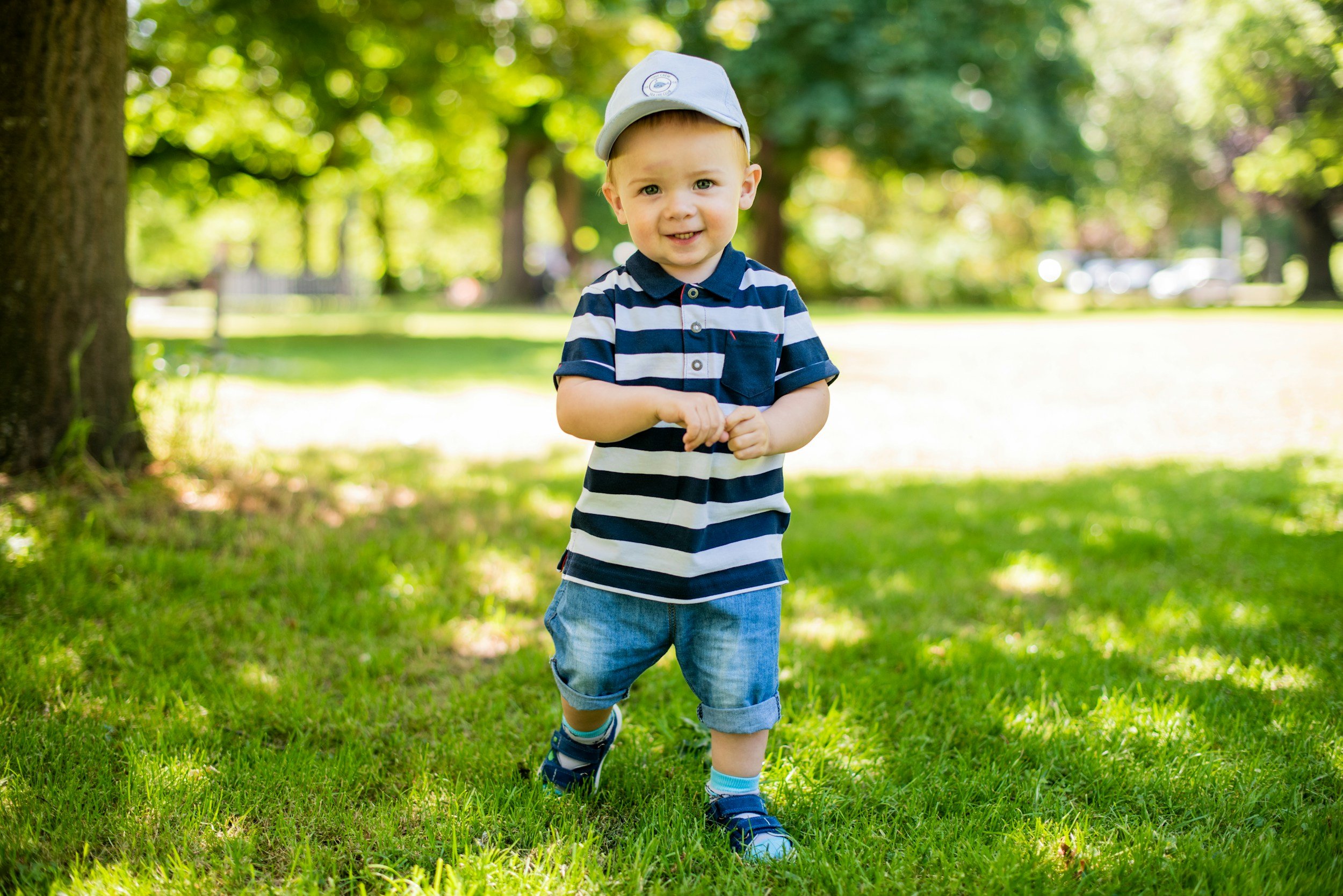 Toddler walking in park.