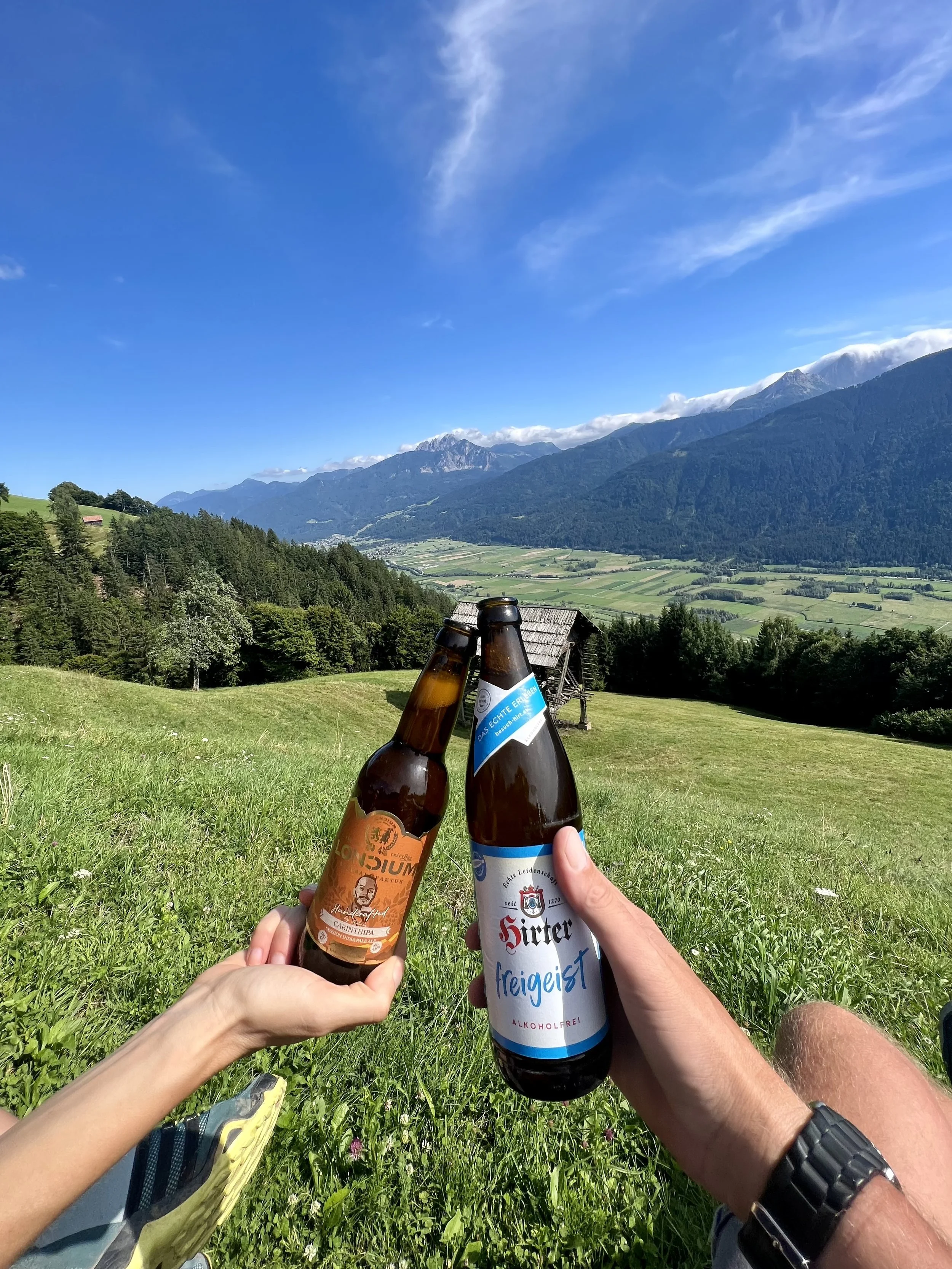 Mid hike refreshments looking over the Gailtal and towards Nassfeld and the Gartnerkofel.