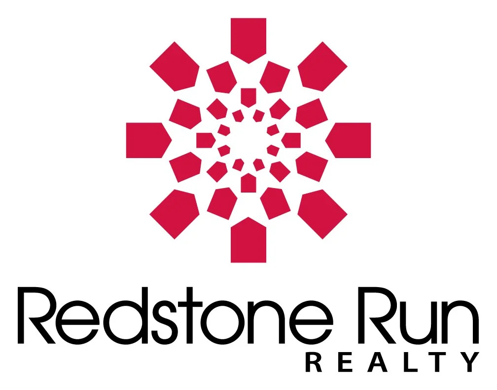 A logo for Redstone Run Realty featuring a stylized red geometric circular design above the company name in black text.