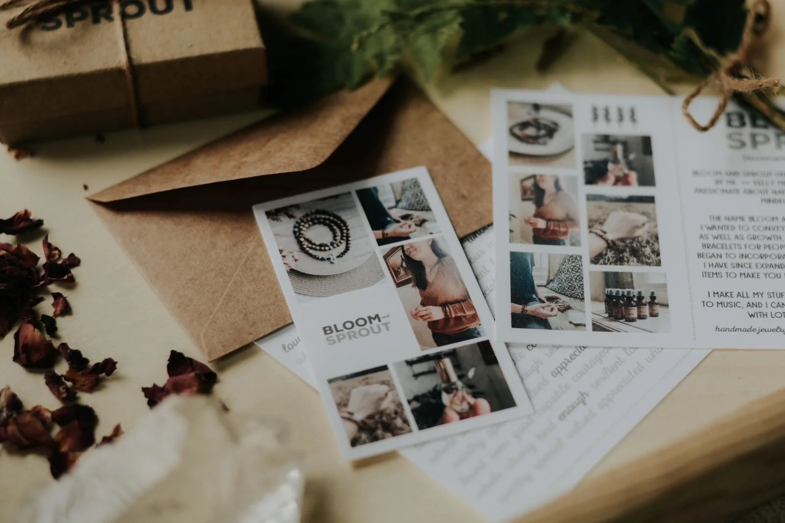 brand photos of business cards surrounded by brown paper envelopes, dried rose petals and quartz crystals