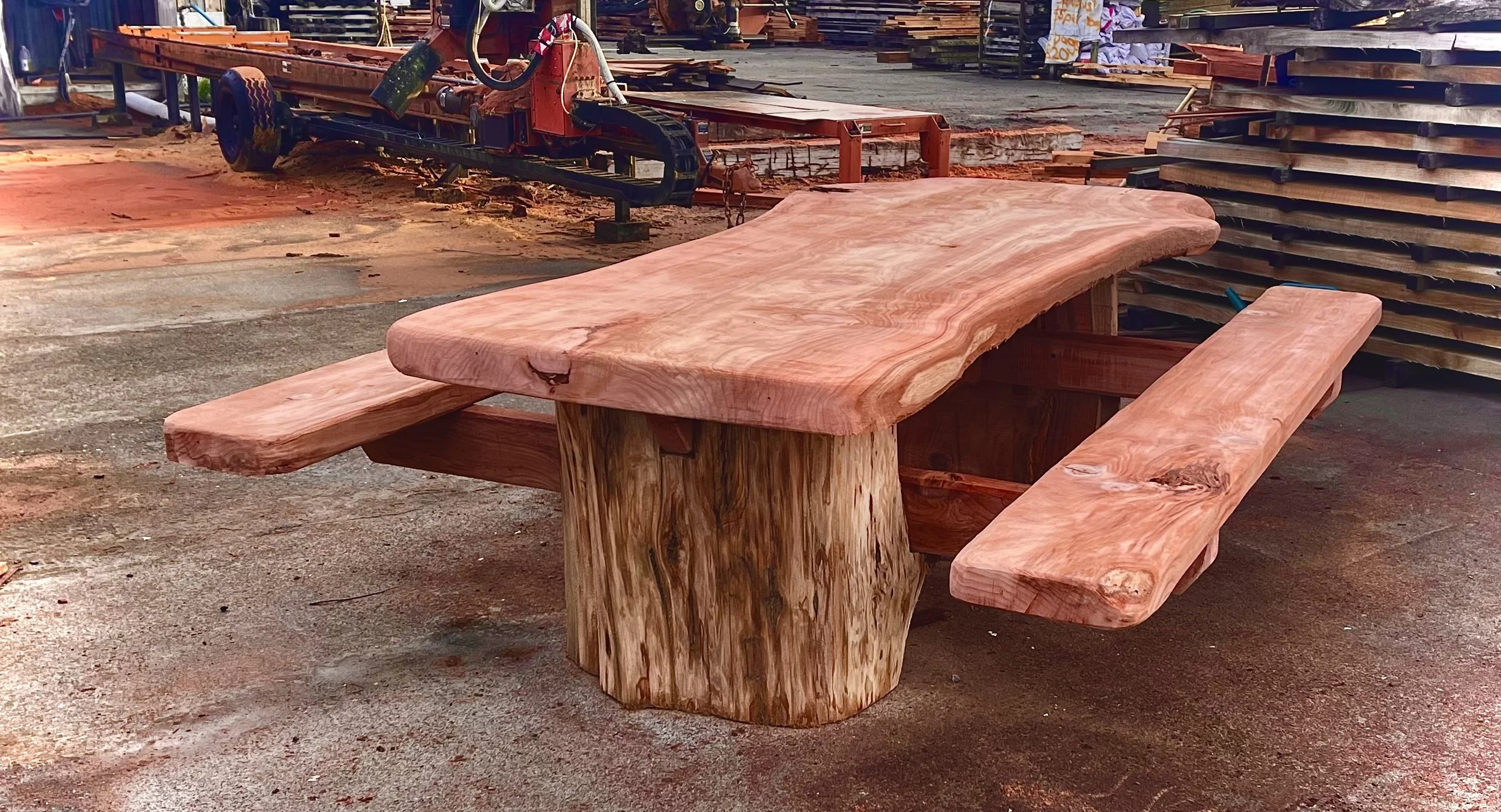 Chunky outdoor table, made of slabs from the gnarly old grey Redwood log.