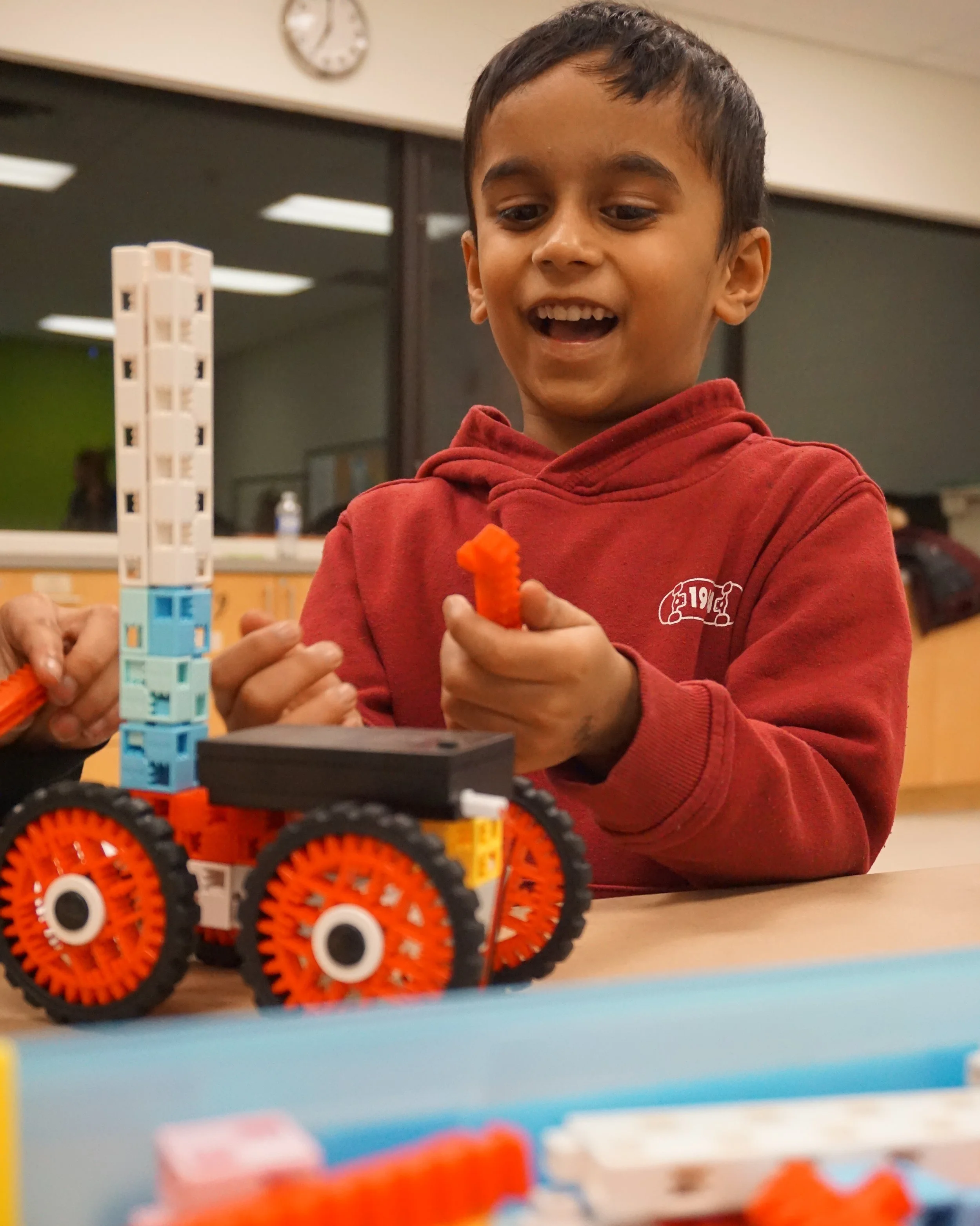 Kids building robots and coding at RoboLab robotics center in North York