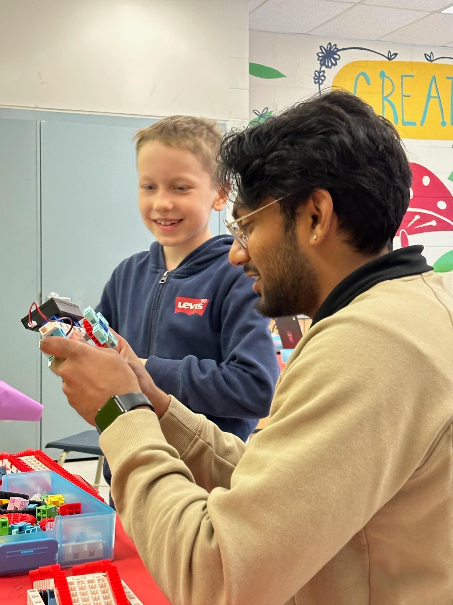 A happy student showcasing a completed STEM project at RoboLab North York
