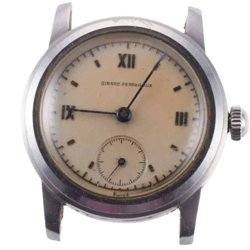 Vintage Girard-Perregaux wristwatch with cream dial, Roman numerals at 12 and 6, and a small seconds subdial at 6 o'clock.