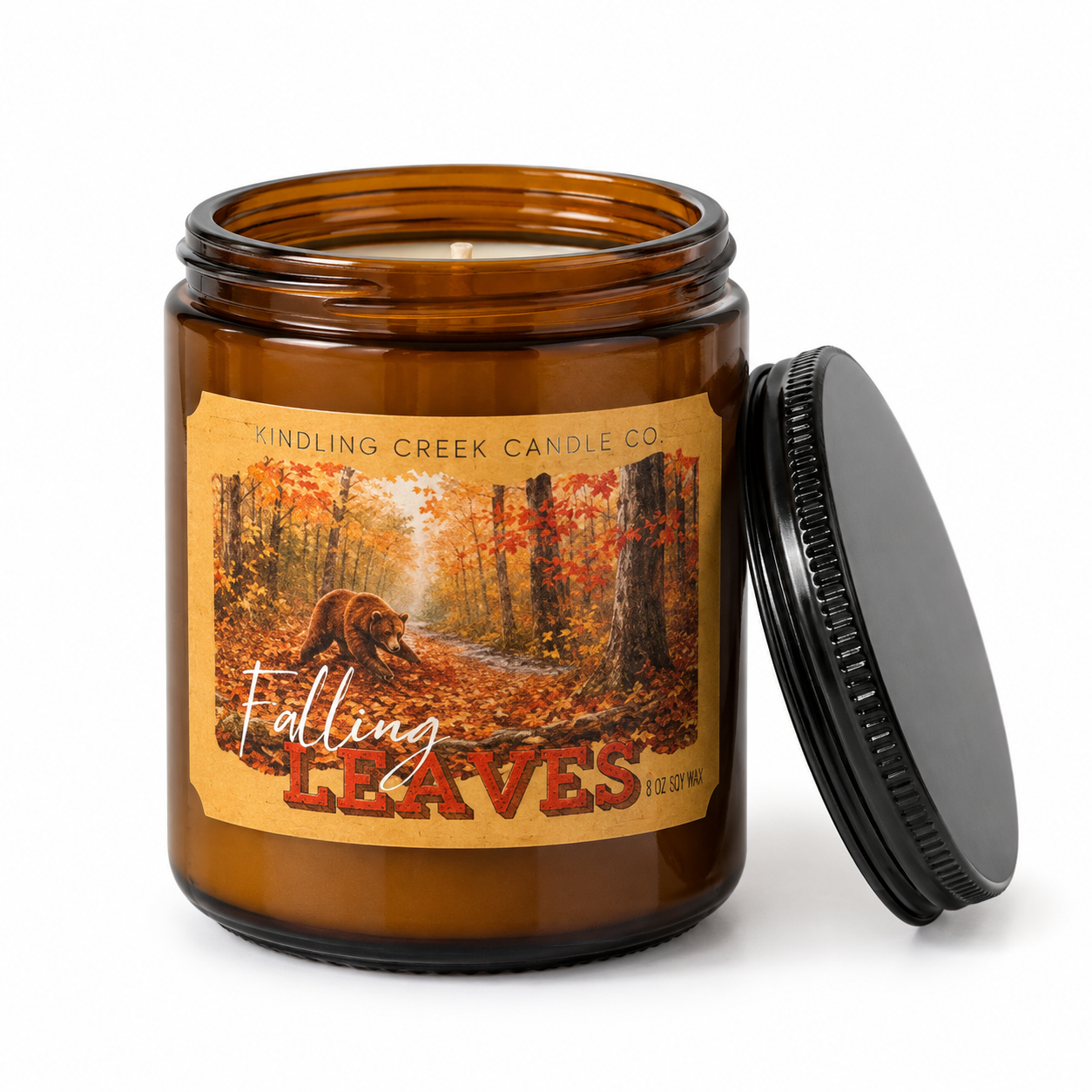 Falling Leaves amber jar candle with black lid and an autumn forest scene featuring a bear.