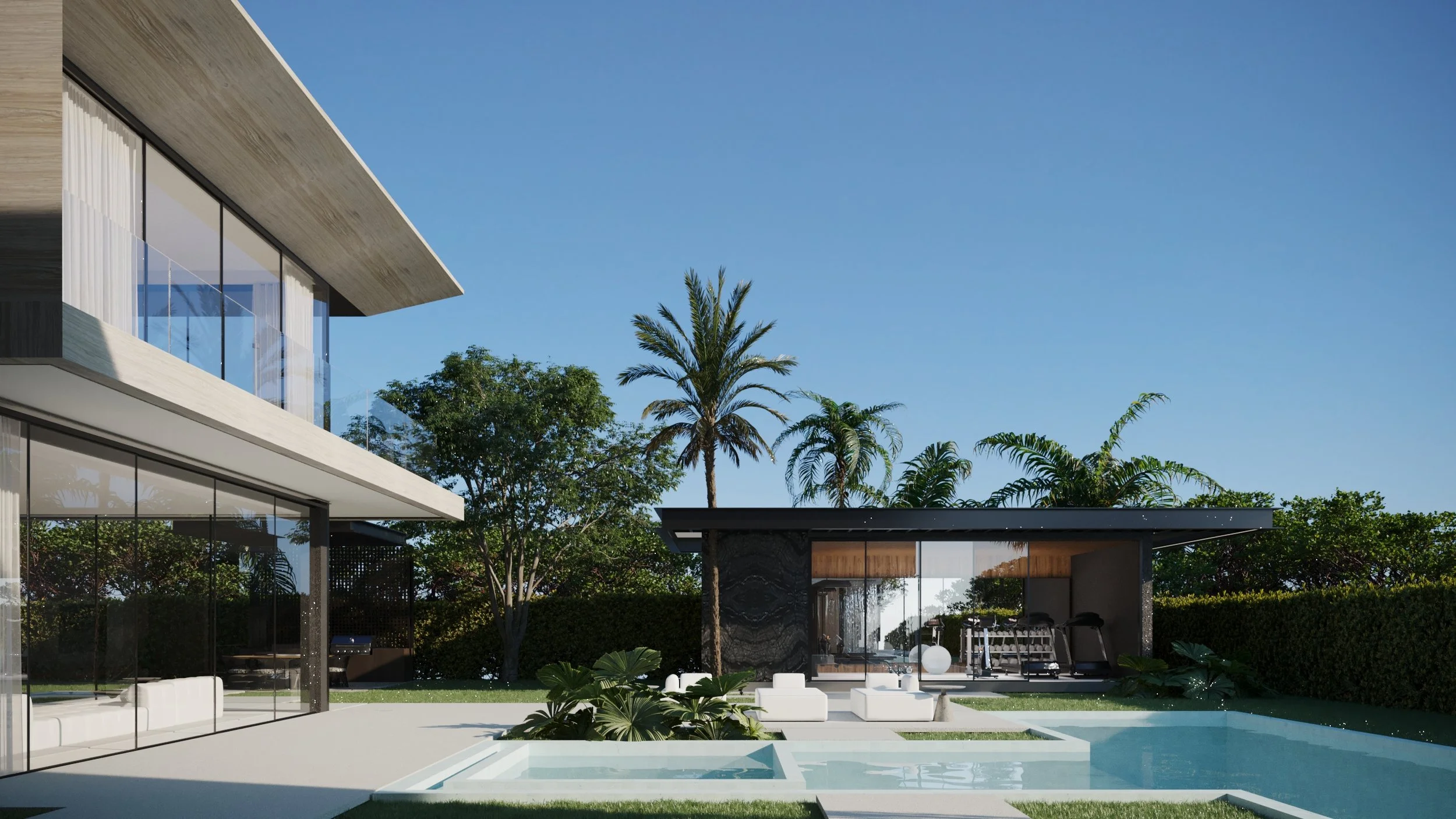 Modern house with large glass windows overlooking a swimming pool, surrounded by lush green trees and palm trees under a clear blue sky.