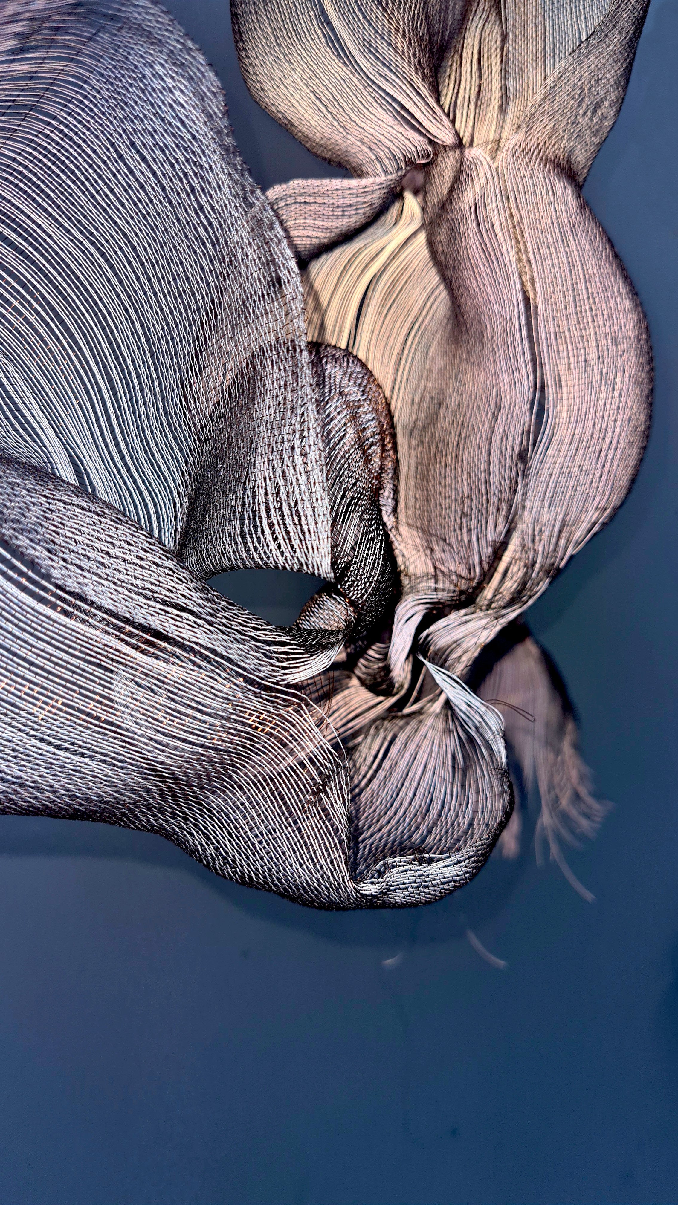 'Branching' detail (flash lighting), 2024, Melanie Olde, handwoven multi-layered reflective thread, copper wire.