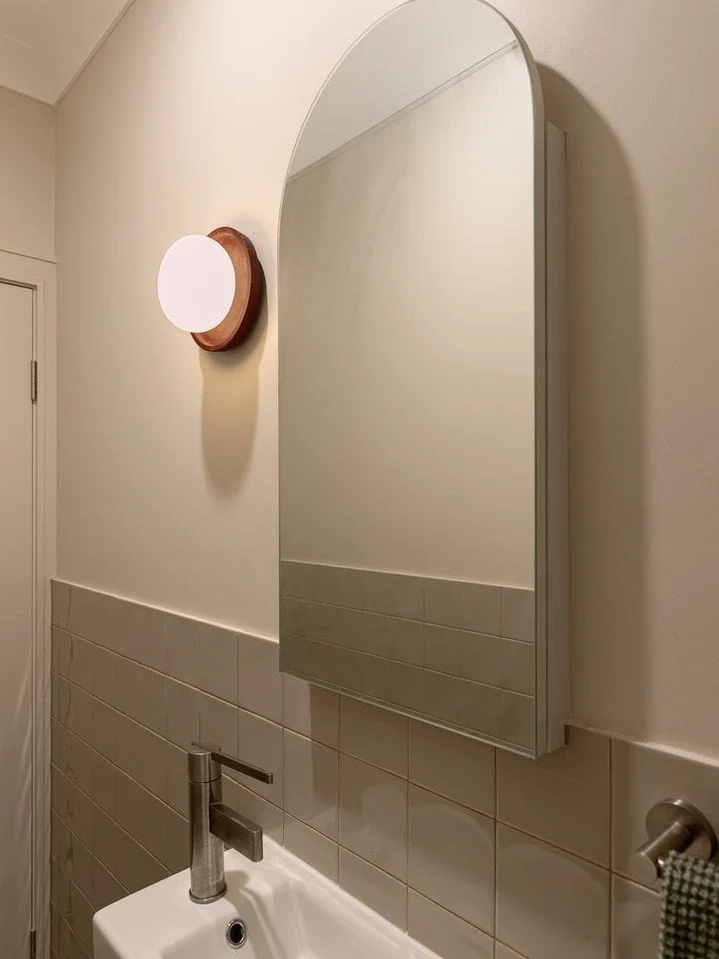 A powder room designed with thoughtful lighting choices and clean lines for a fresh, minimal feel.

Interior Design @moriandcurllstudio 
Builder @forever_build 
Joiner @urbanjoinery 
Tiler @__samwalsh__
Plumber @alphaflowplumbing 
Photography @life.i