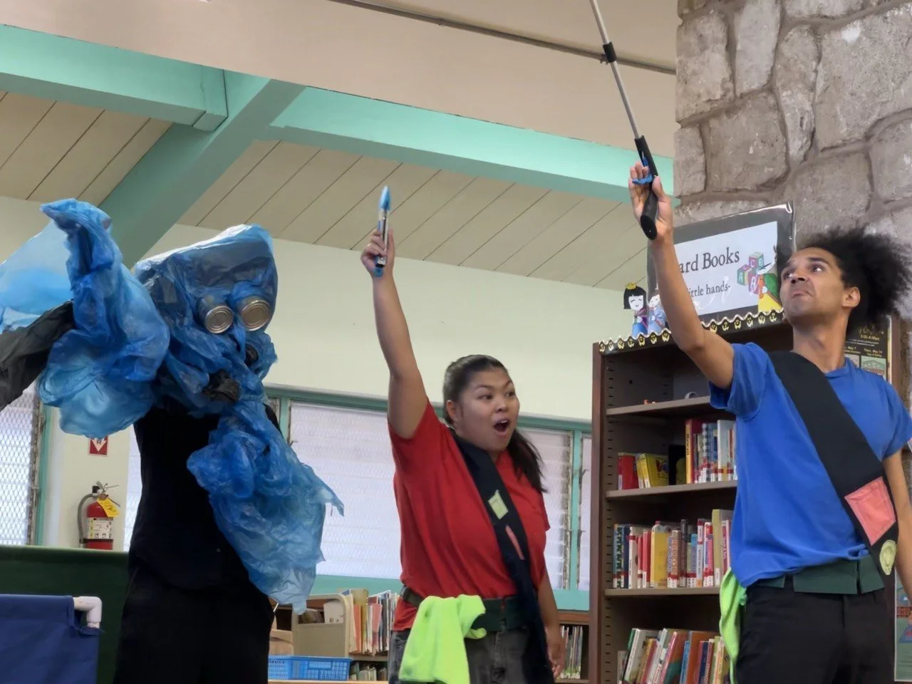 Peepa, Flomo, and the Spirit do the cleaning salute.