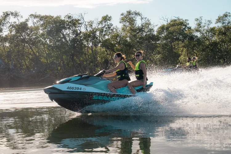 Jetski riders cruising past the islands