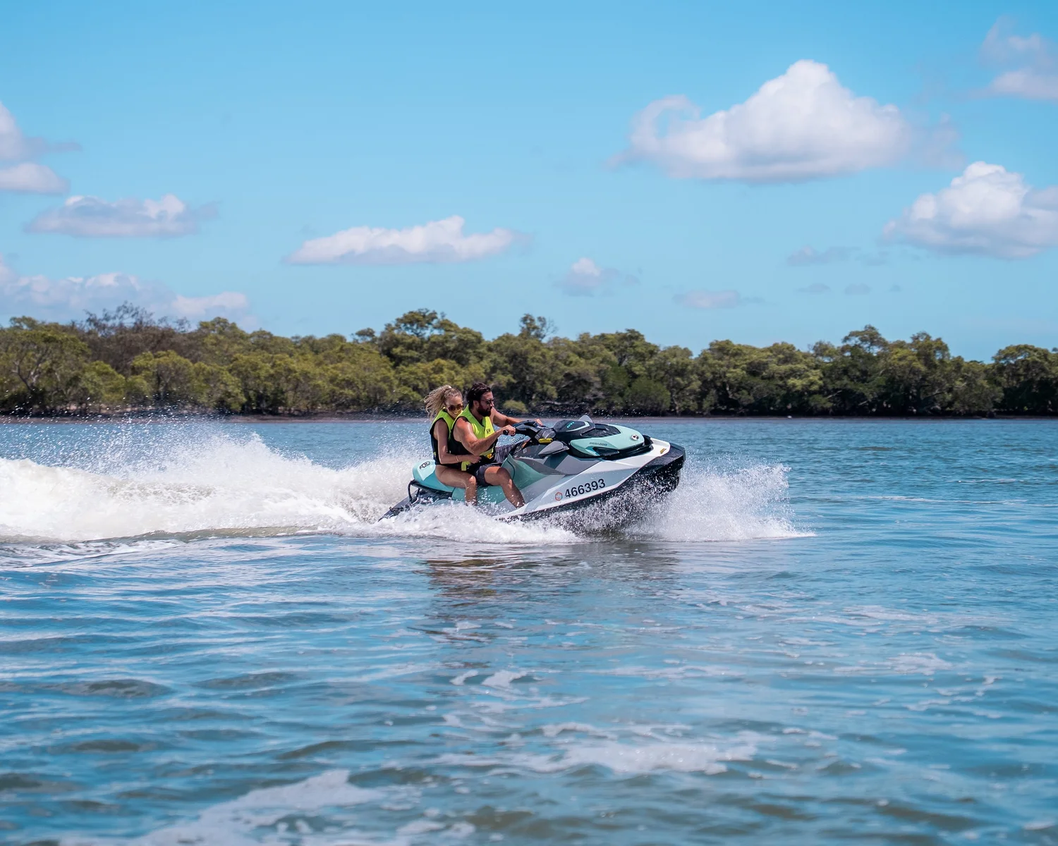 Jetski riders arriving at North Stradbroke Island beach on a 3-hour Gold Coast adventure tour
